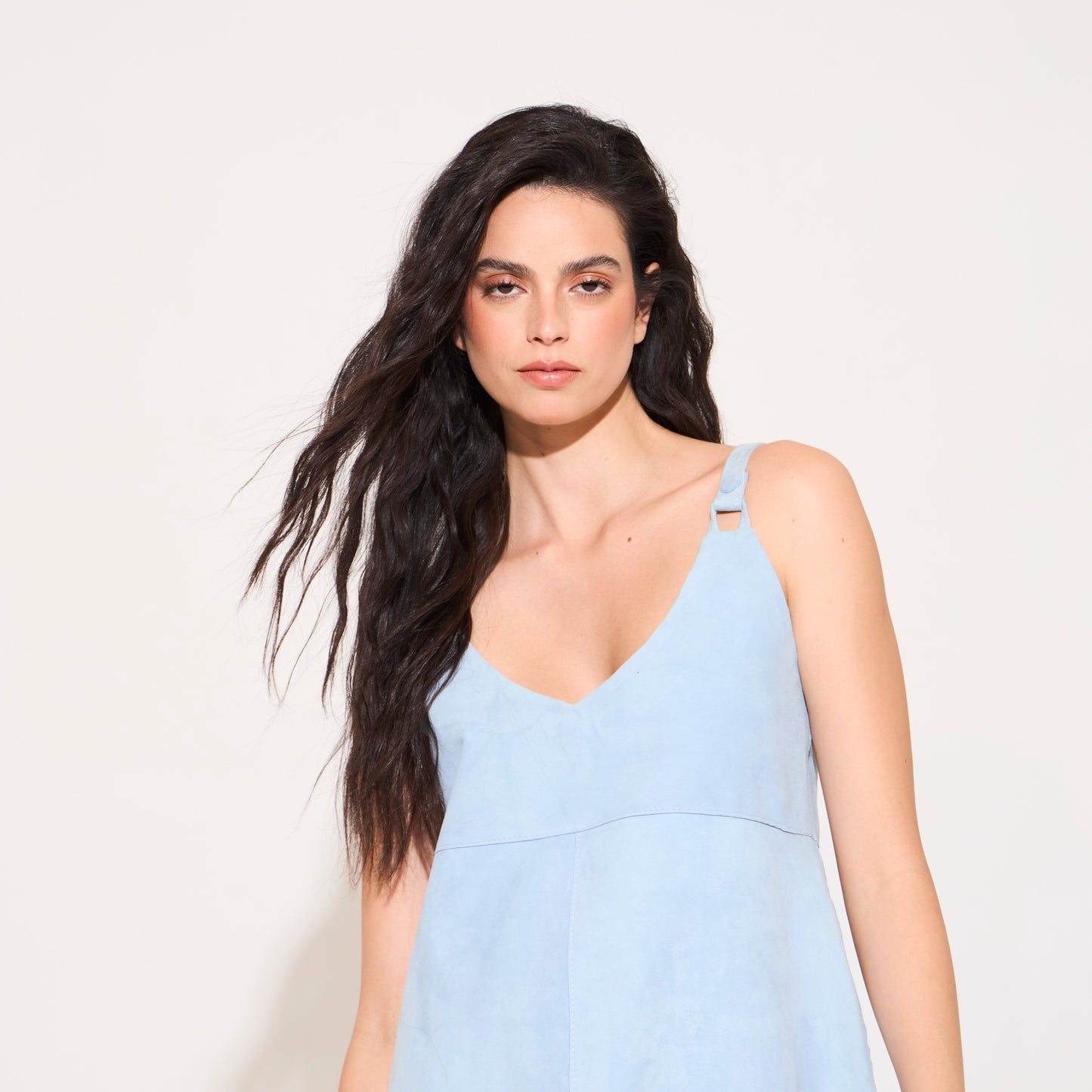 Top de gamuzza celeste con tiras